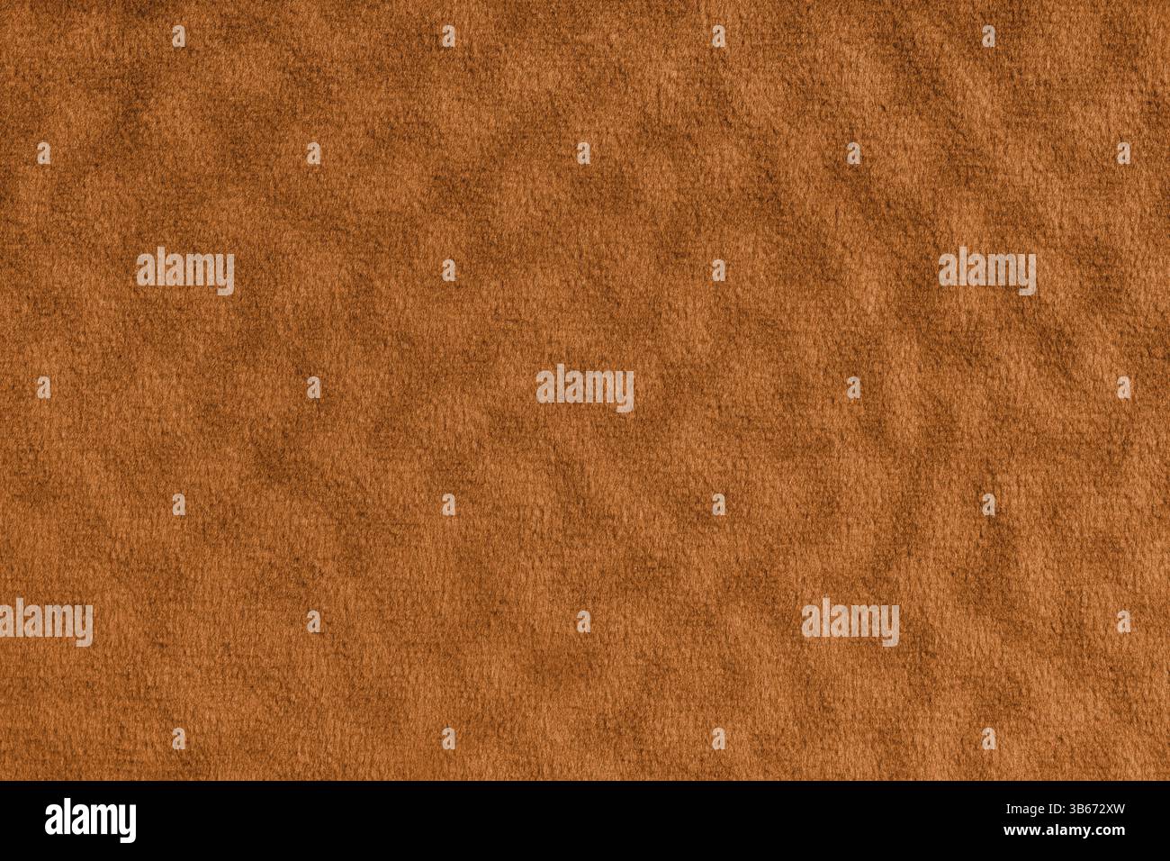 Kunstfell, Veloursstoff in Orange oder Tuch mit Welleneffekt. Flauschiges Gewebe aus Kunstpelz-Textilmaterial-Textur-Makro. Hintergrund der Arbeitsfläche. Decorati Stockfoto