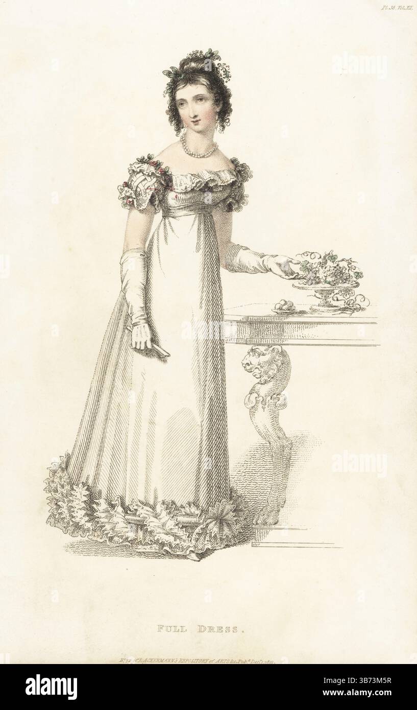 Modische Frau in voller Kleidung auf einem Vereinsfest, 1821. Weißes rundes Samtkleid mit einem blonden tucker a l'enfant, wilden Blumen auf der Schulter, besticktem und gerafftem Rock, Kinderhandschuhen, Kreppfächer, weißen Hausschuhen. Entworfen von Miss Pierpoint, 12 Edwards Street, Portman Square, Erfinder des Korsetts a la Grecque. Platte 35. Handkolorierter Kupferstich von Thomas Uwins alias Arbiter Elegantiarum aus Rudolph Ackermann's Repository of Arts, Strand, London, Dezember 1821. Stockfoto