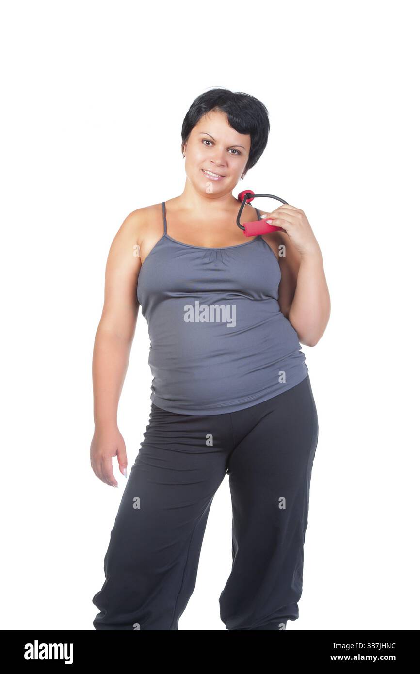 Fette Frau mit Thoraxexpander Stockfoto