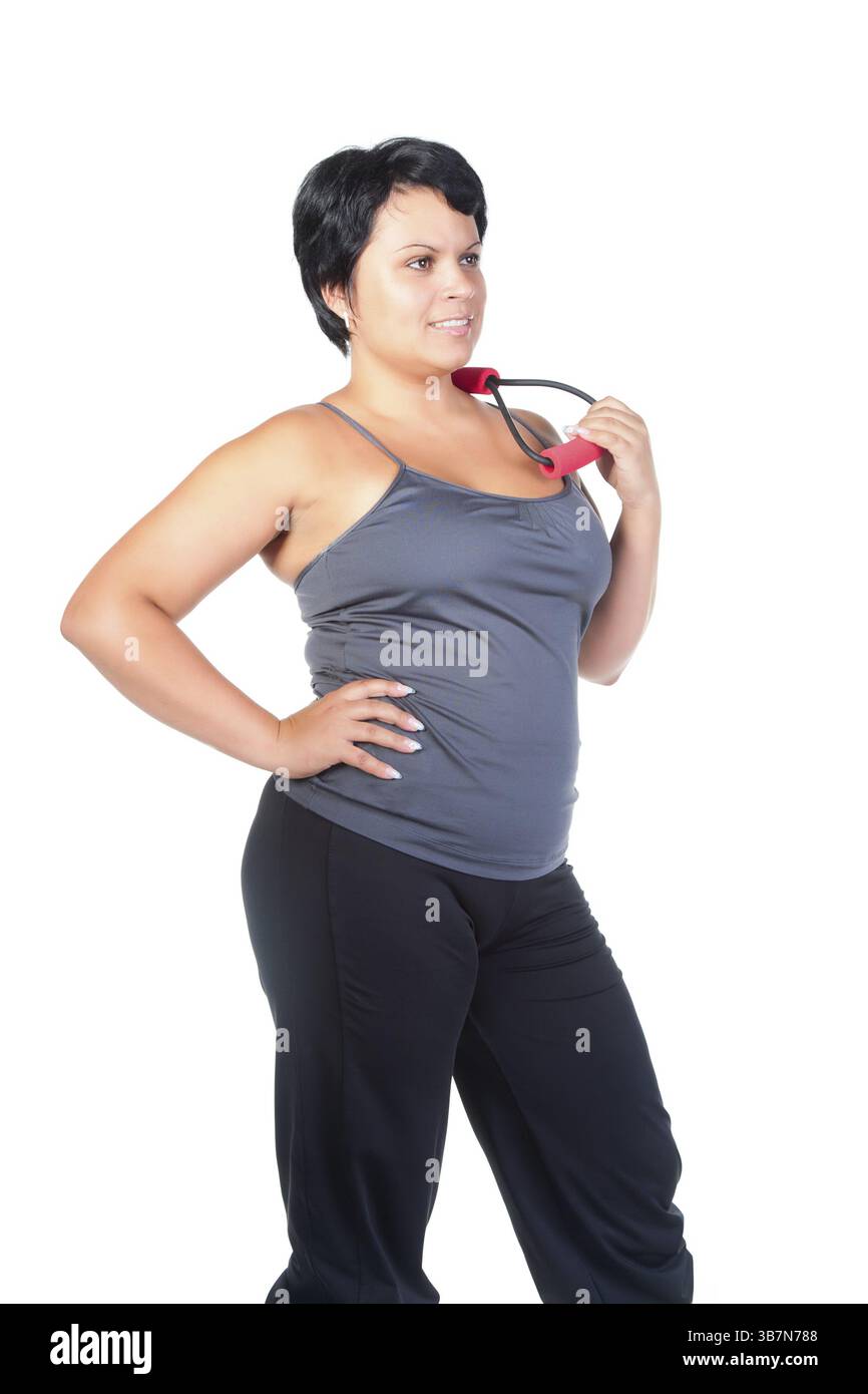 Fette Frau mit Thoraxexpander Stockfoto