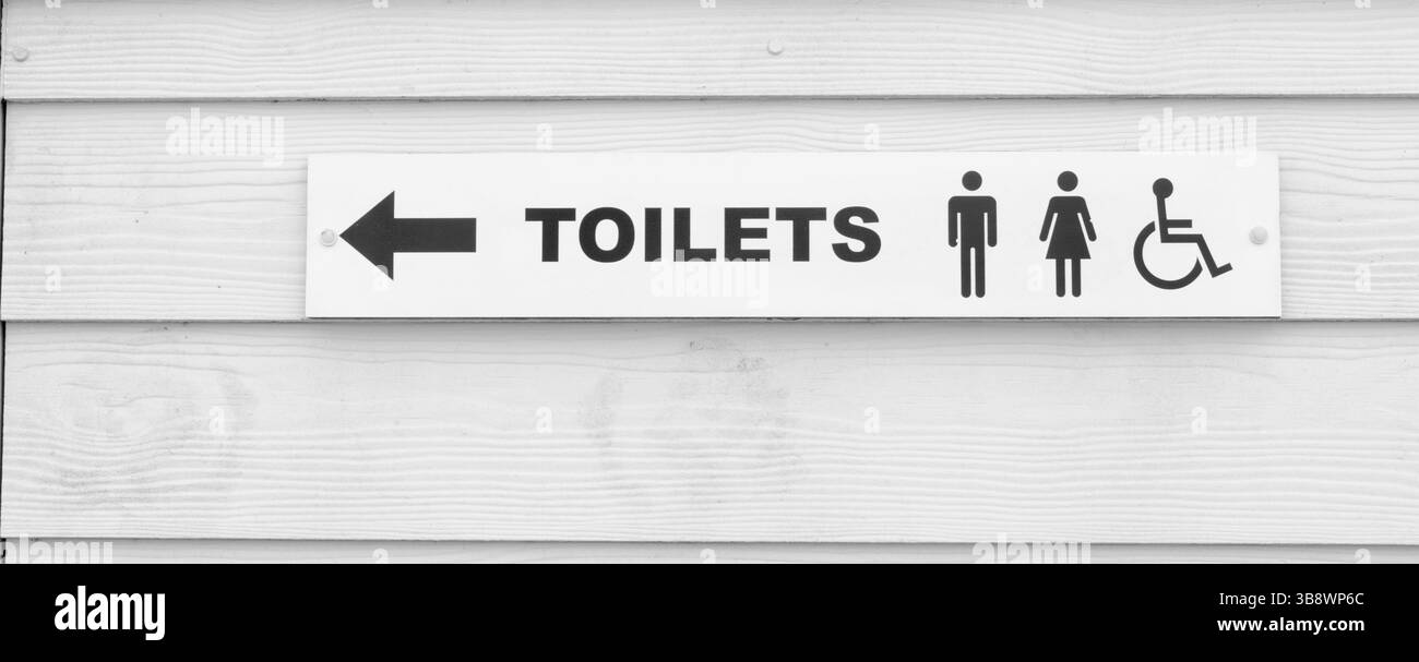 Ein Schild in schwarz-weiß zeigt den Weg zur Toilette Essex UK Stockfoto