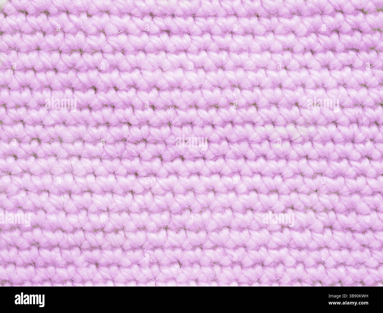 Hellrosafarbenes Stricktrikot als textiler Hintergrund Stockfoto