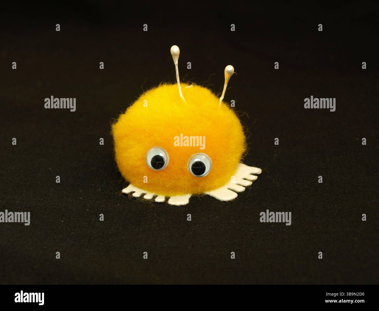 Gelbes Miniaturmaskottchen Stockfoto