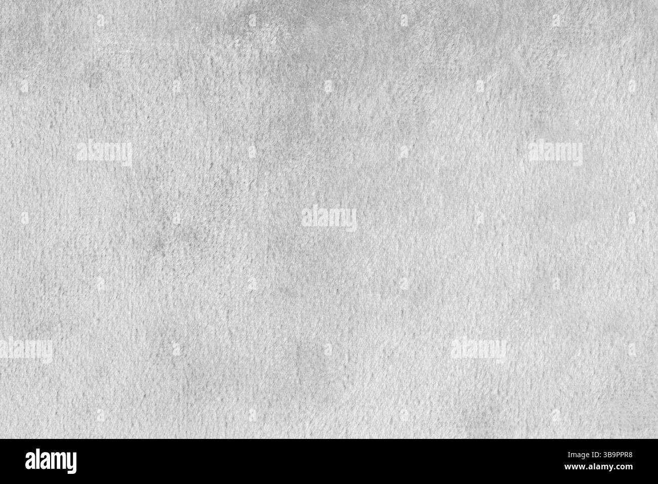 Kunstfell, glänzender Seidensamtstoff in weiß oder Stoffmakro, Nahaufnahme. Die flauschige Gewebeschicht aus Kunstpelztextilien. Hintergrund der Arbeitsfläche. Dekora Stockfoto