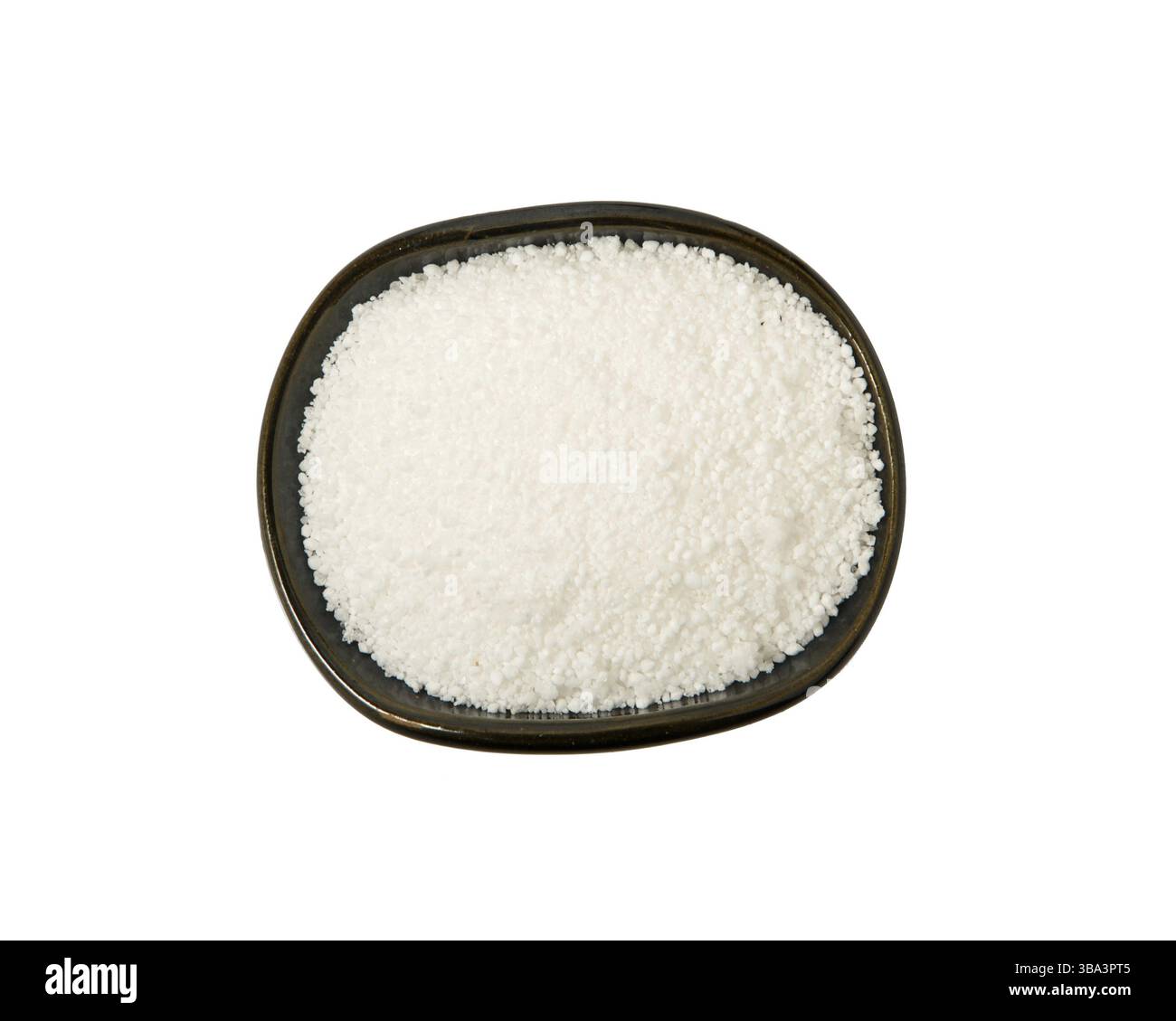 Zitronensaeure in einem Schuessel isoliert auf einem weissen Hintergrund. Blick von oben Stockfoto