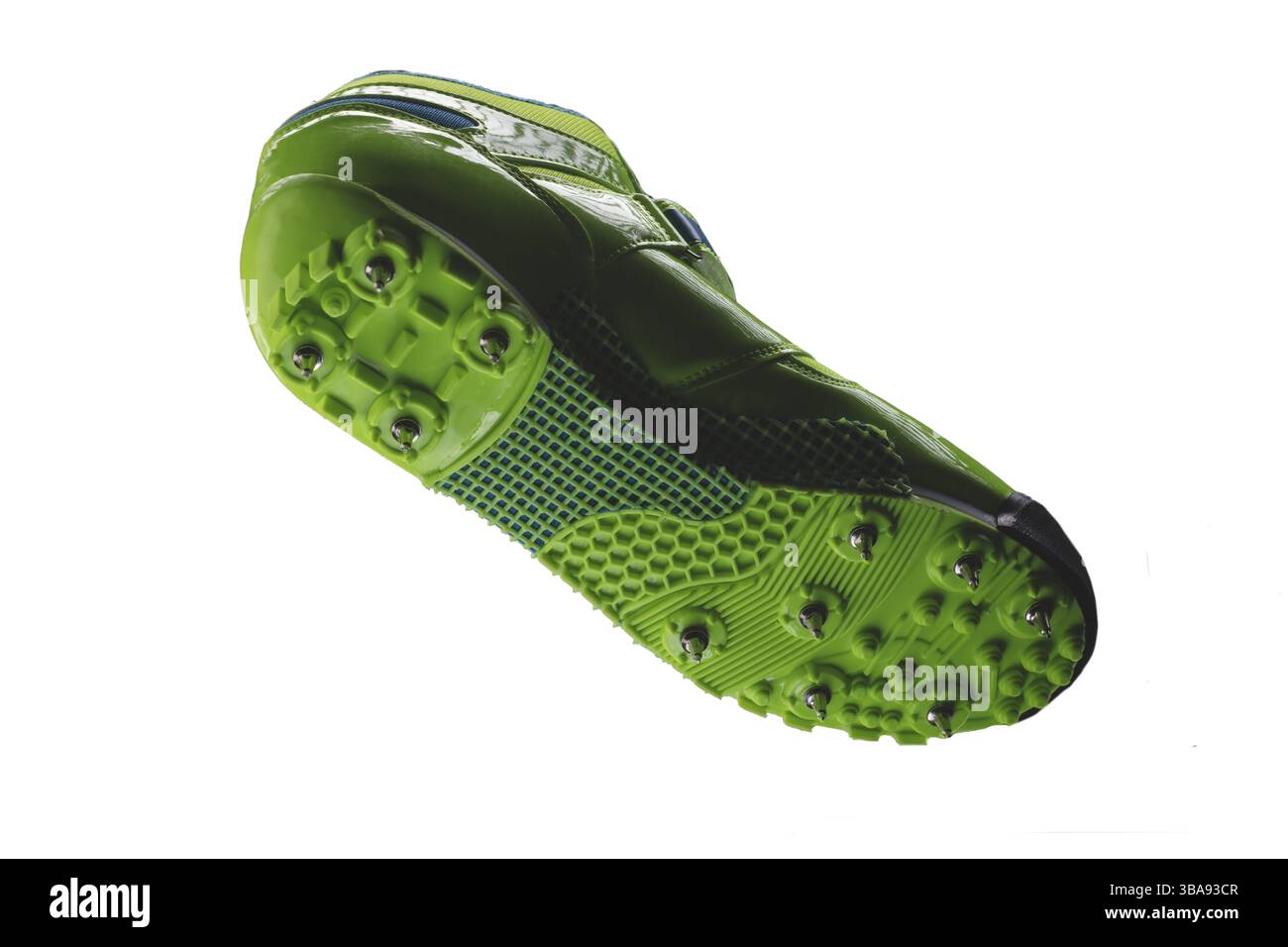 Grüne Sohle mit Stacheln auf weißem Hintergrund. Sportschuhe Stockfoto