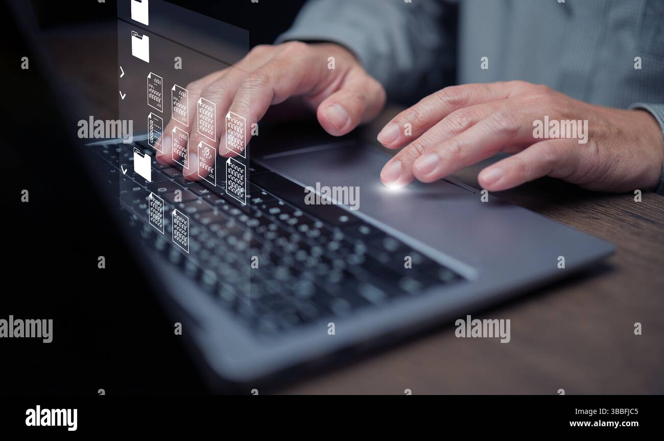 Konzept des Dokumentverwaltungssystems. Ein Mann, der DMS-Software auf seinem Laptop verwendet, um Dateien oder Dokumente zu speichern, freizugeben, zu verfolgen und zu verwalten. Stockfoto