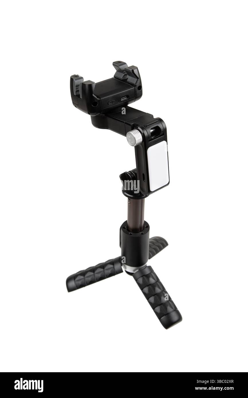 Kompakter Gimbal-Stabilisator für Telefone mit Stativbeinen und LED-Panel für freihändige Videos. Stockfoto