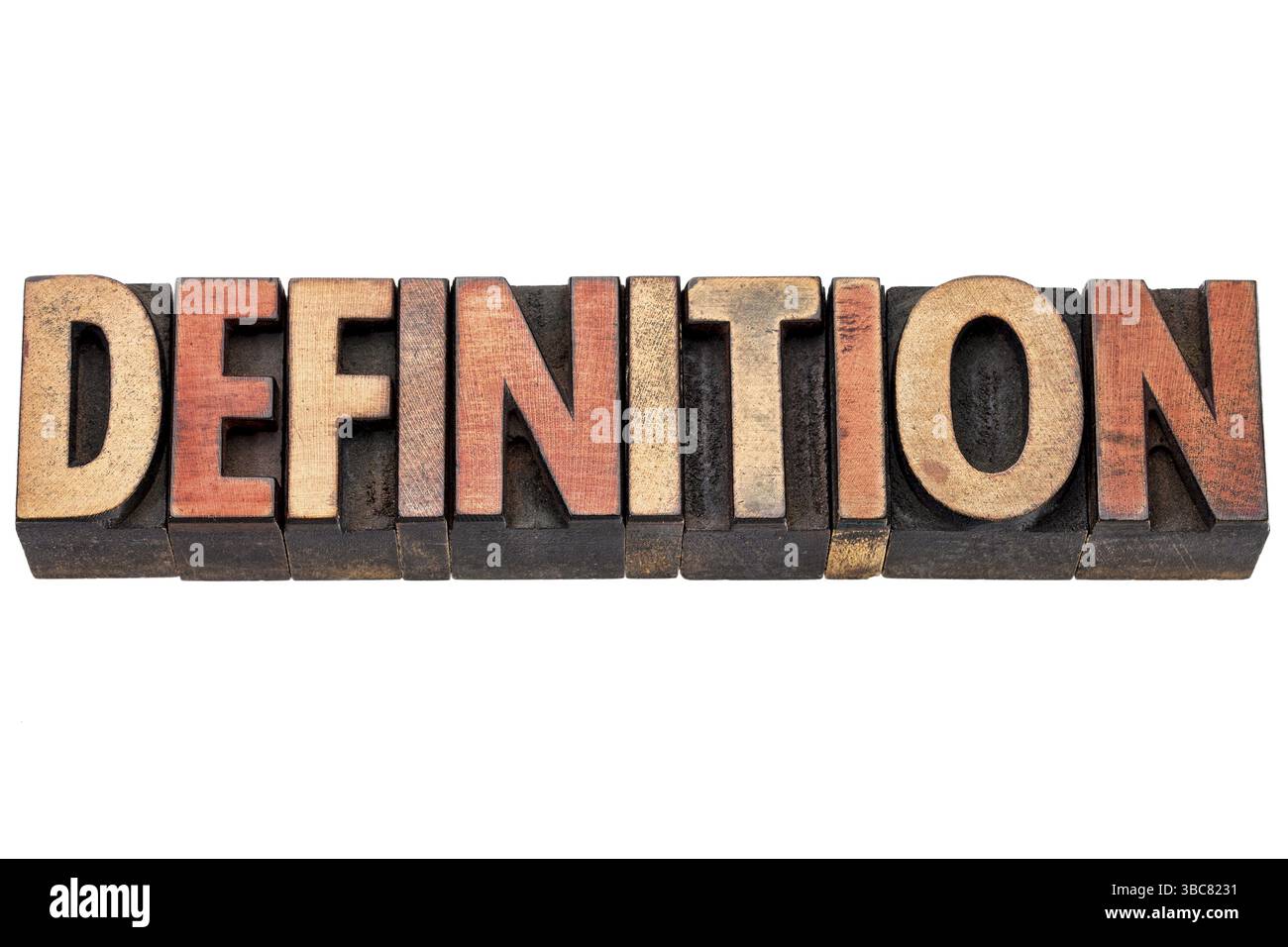 Definition-Worttypografie in Vintage-Buchdruckblöcken mit Farbtinten gebeizt Stockfoto