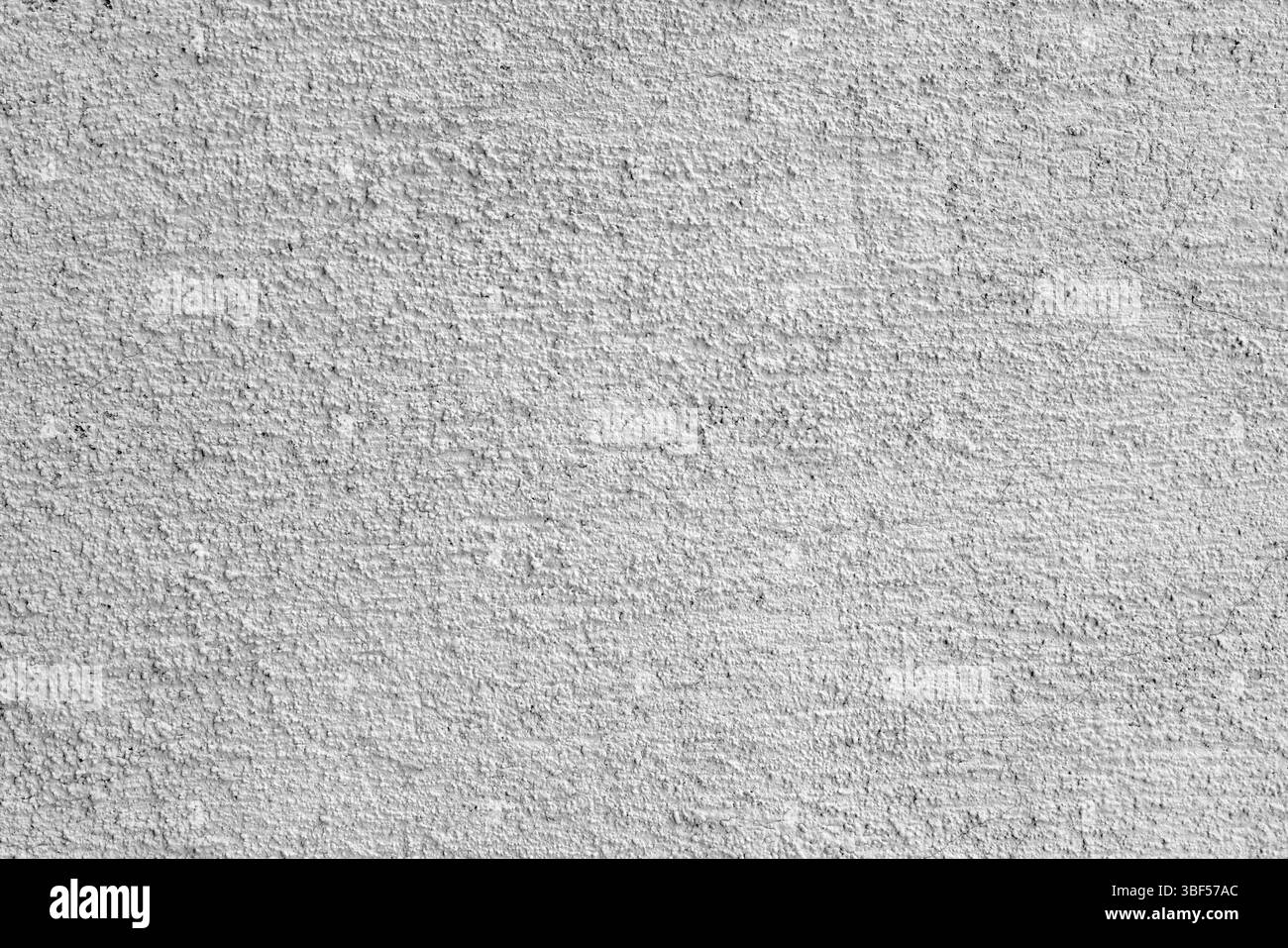 Grauer Stuck an der Hauswand. Bauindustrie Stockfoto