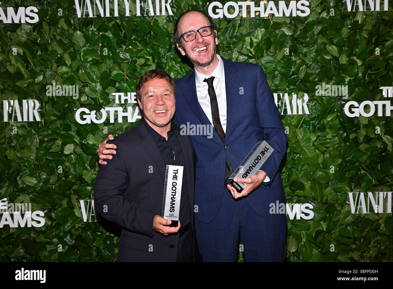 Stephen Graham, left, and Jack Thorne pose in the winner's room with the awards for breakthrough limited series for "Adolescence" during the Gotham Television Awards on Monday, June 2, 2025, at Cipriani Wall Street in New York. (Photo by Evan Agostini/Invision/AP) Stockfoto
