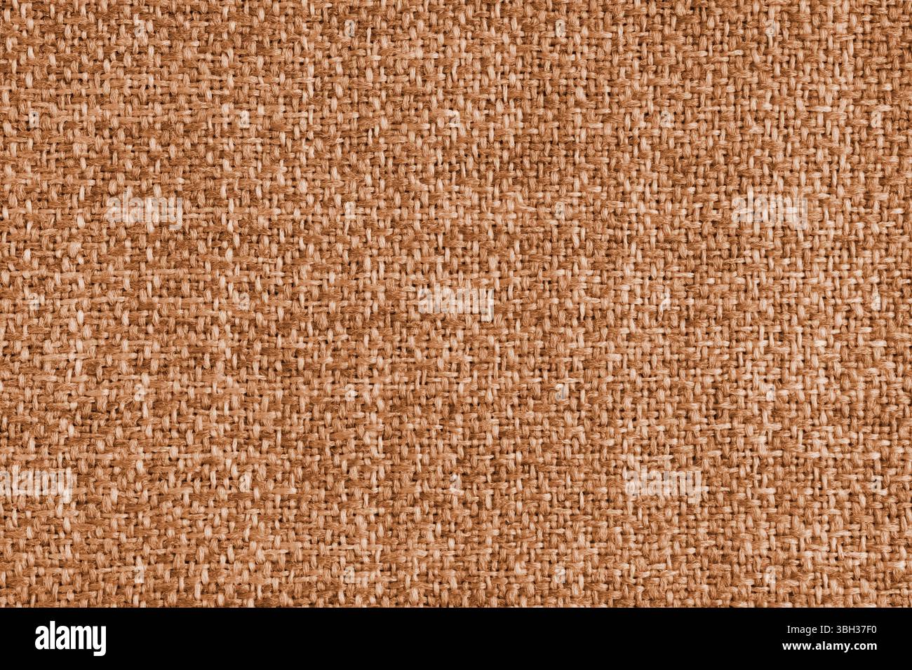 Polsterung mit orangefarbenem Jacquard-Stoff in grober Webstruktur. Textilhintergrund, Möbel Textilmaterial, Tapete, Hintergrund. Stoffstruktur c Stockfoto