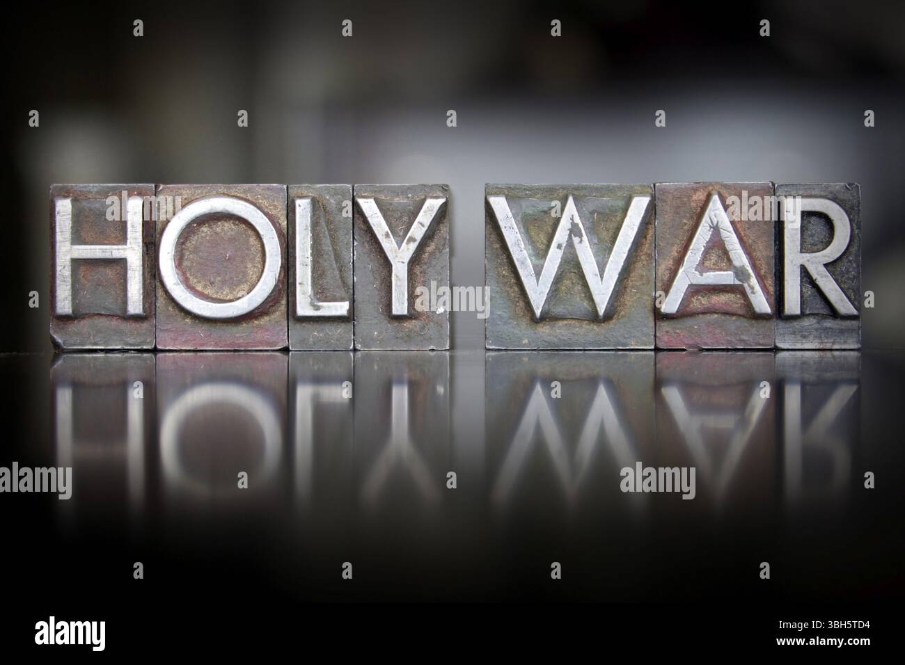 Die Worte Heiliger Krieg, geschrieben in Vintage-Buchdruckschrift Stockfoto