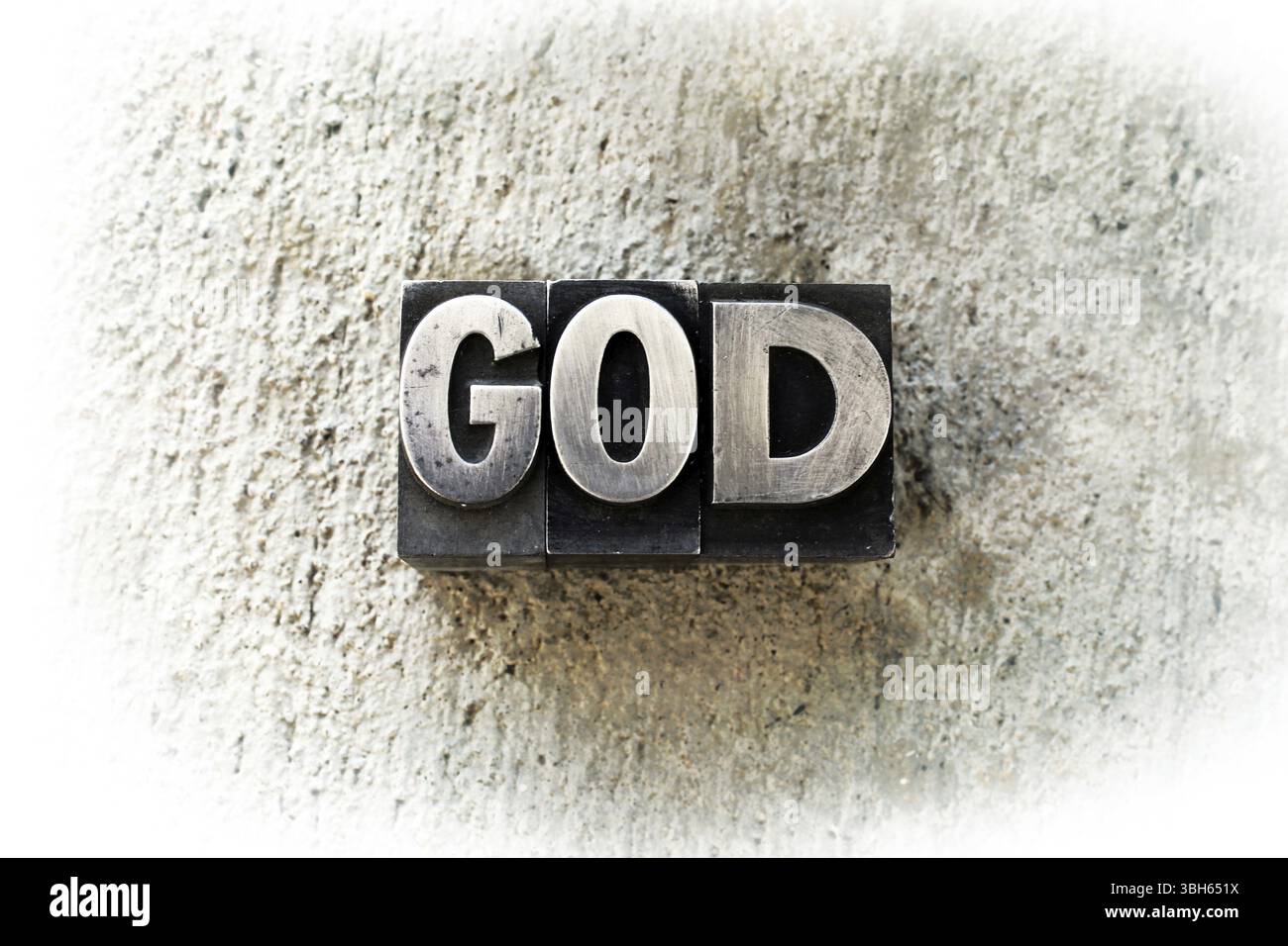 Der Name GOD in alter alter alter Buchdruckart geschrieben Stockfoto