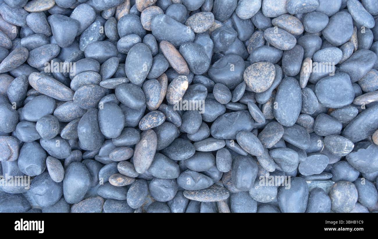 Kleine schwarze Steine Stockfoto