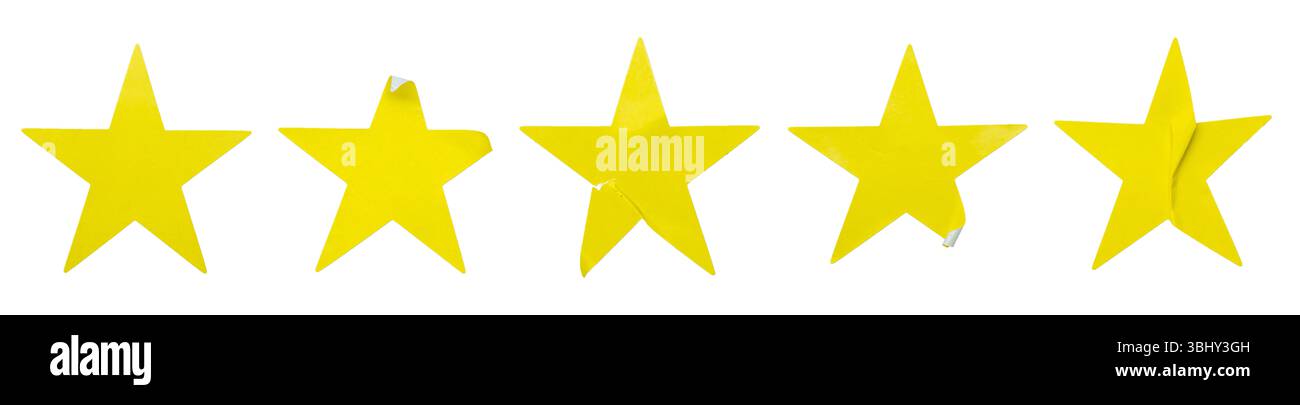 Ein Satz gelber, sternförmiger Papieraufkleber, isoliert auf weißem Hintergrund. Stockfoto
