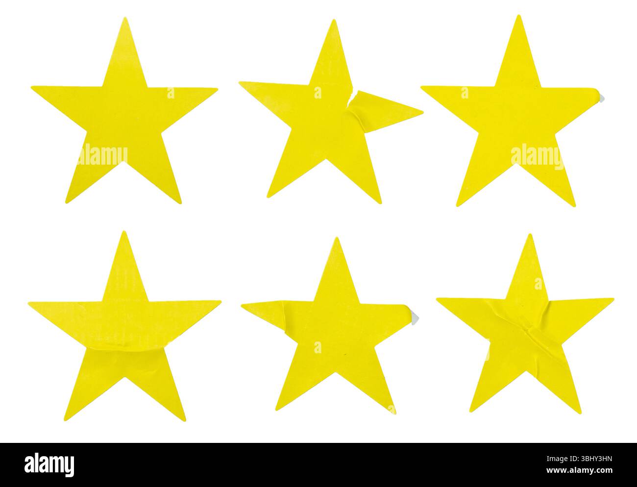Ein Satz gelber, sternförmiger Papieraufkleber, isoliert auf weißem Hintergrund. Stockfoto