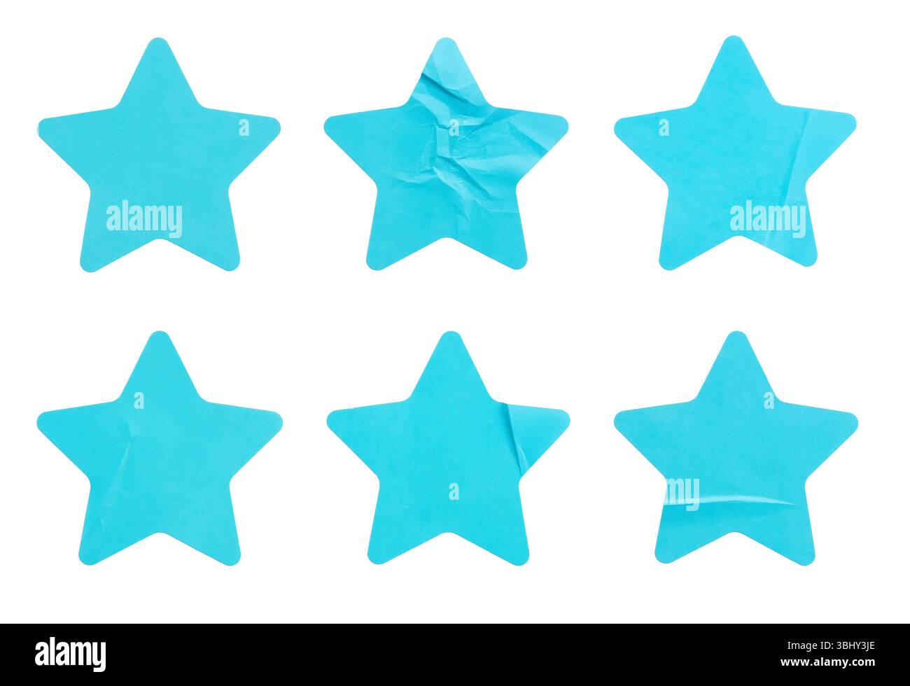 Ein Satz blauer, sternförmiger Papieraufkleber, isoliert auf weißem Hintergrund. Stockfoto