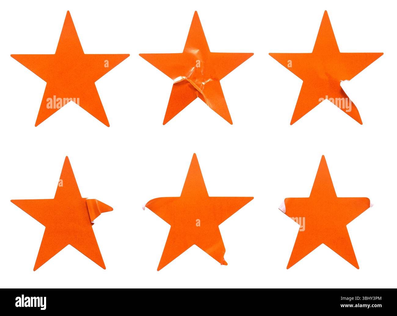 Ein Satz orangefarbener, sternförmiger Papieraufkleber, isoliert auf weißem Hintergrund. Stockfoto