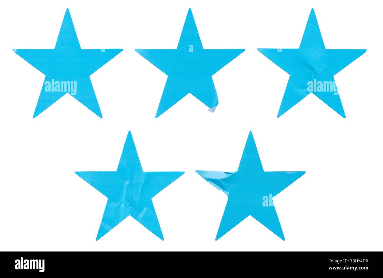 Ein Satz blauer, sternförmiger Papieraufkleber, isoliert auf weißem Hintergrund. Stockfoto