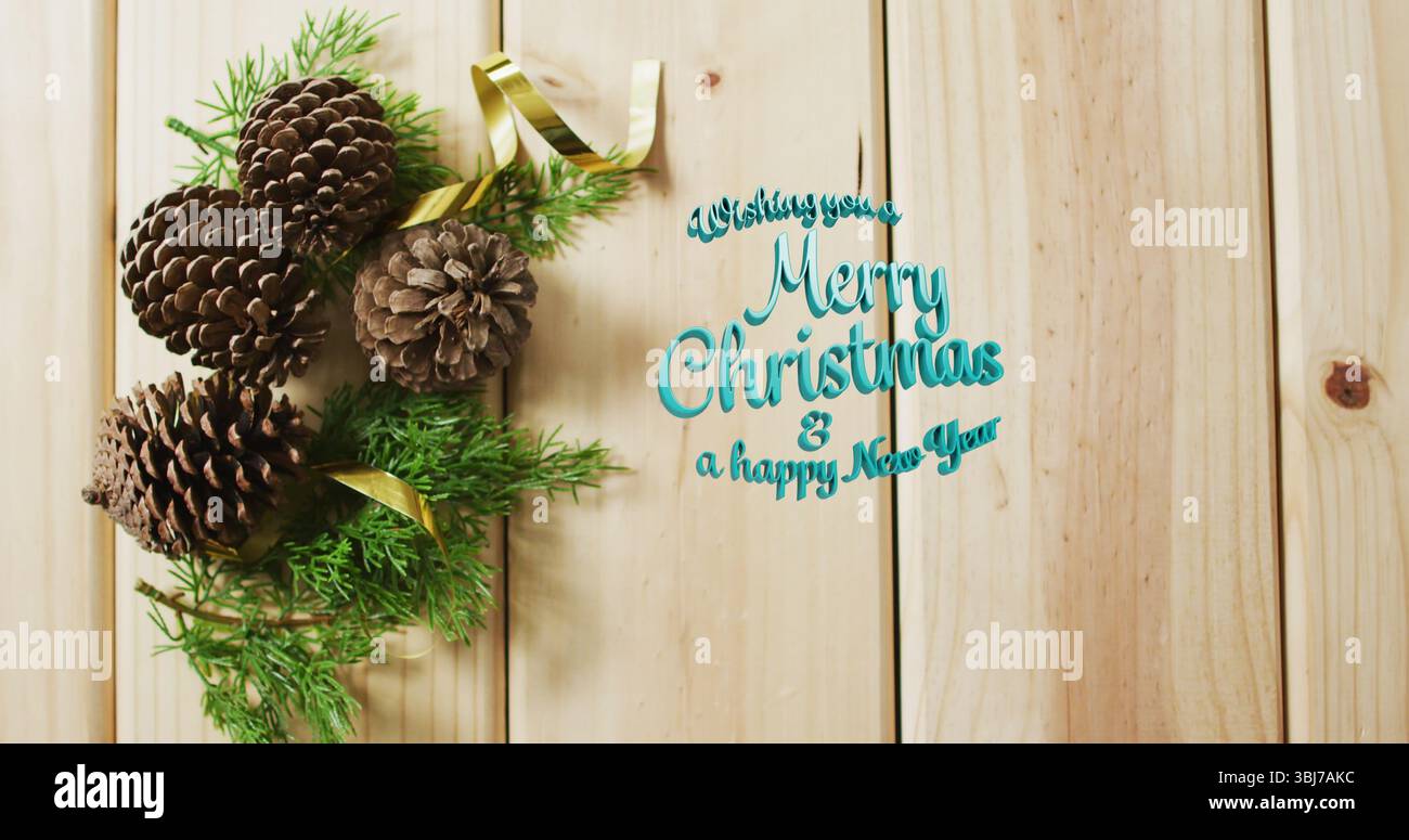 Tannenzapfen mit immergrünen Zweigen auf Holztafel, goldenes Band und grüner Gruß, Kopierraum Stockfoto