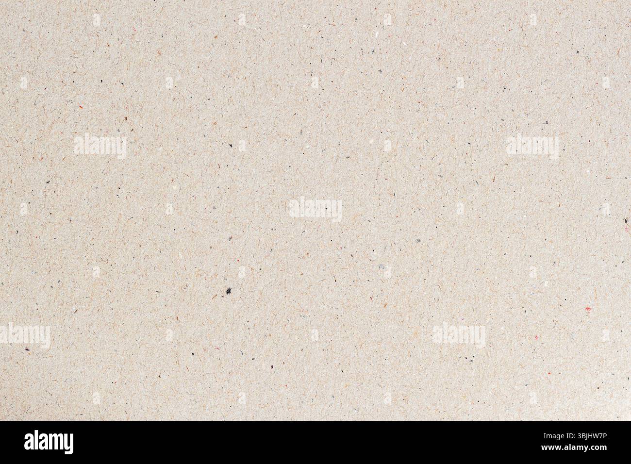 Hintergrund aus Recyclingpapier mit weichen Fasern und dezenten Flecken in hellem Ton. Umweltfreundliche, neutrale Textur für natürliche Designs. Konzept des Recyclings Stockfoto