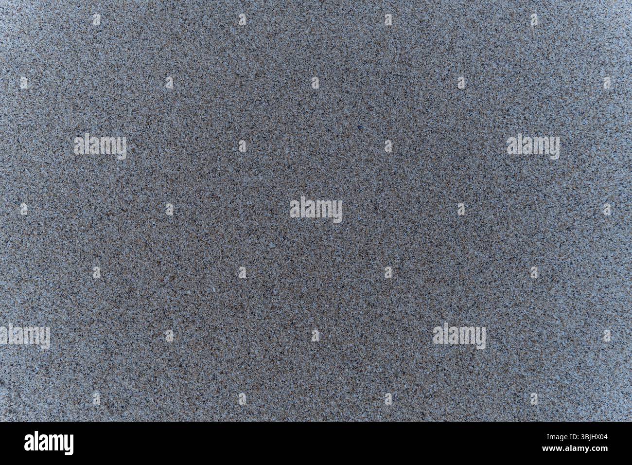 Hochauflösende Nahaufnahme der natürlichen Sandstruktur. Ideal für den Einsatz in Hintergründen, Designprojekten, digitalen Texturen oder naturbezogenen Inhalten. Stockfoto