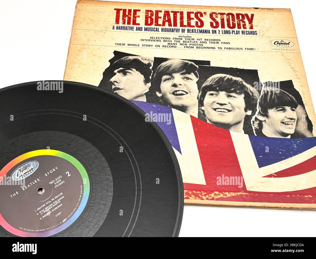 Eine Vintage-Schallplatte der Geschichte der Beatles mit Porträts von John Lennon, Paul McCartney, George Harrison und Ringo Starr. Stockfoto