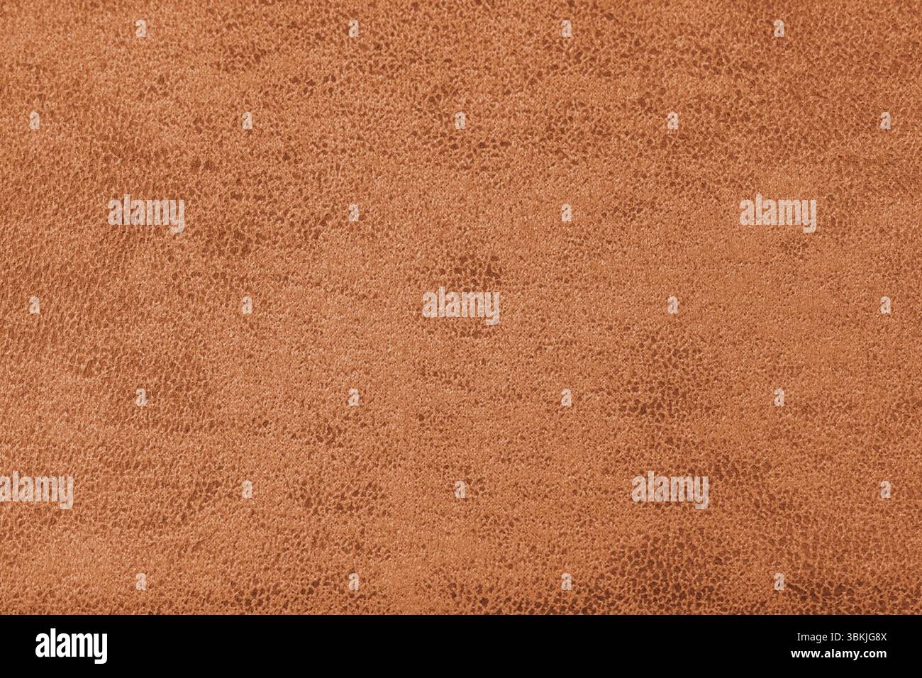 Struktur aus orangefarbenem Wildledergewebe mit abstrakter Shabby-Textur mit geprägten Farbnuancen in Großansicht, Makro. Polsterung, dekorative Stoffstruktur, Leinwand für Stockfoto