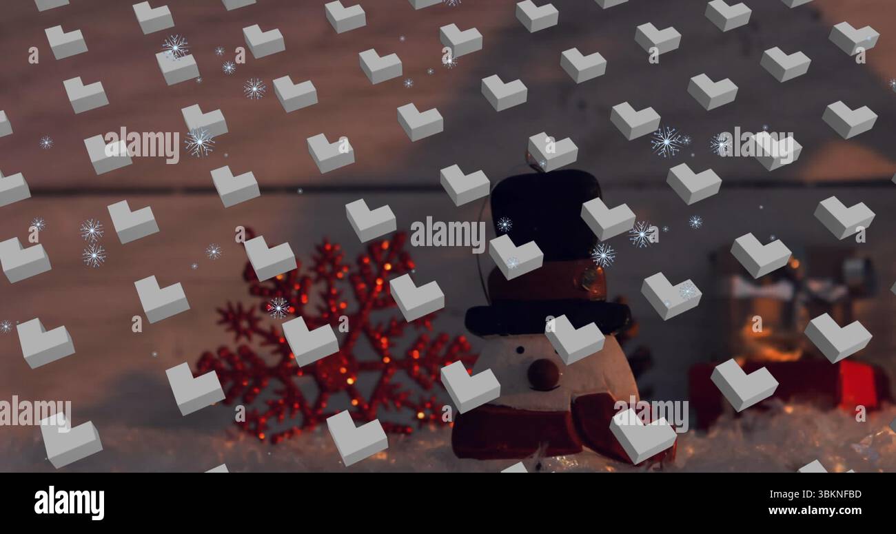 Mit Schneemännern mit schwarzem Hut und rotem Schal auf der Fensterbank, beleuchteter Schneeflocke und Geschenk Stockfoto