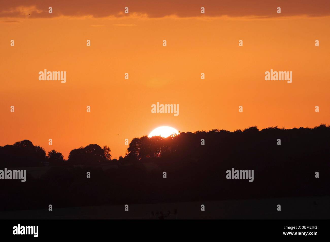 Sonnenaufgang am längsten Tag der Sommersonnenwende auf der salisbury Playa wiltshire UK Stockfoto