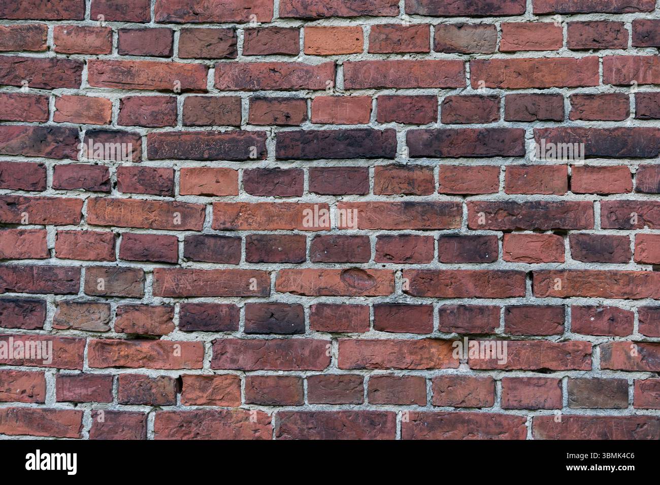 Rote Ziegelwand. Architekturhintergrund für Designprojekte Stockfoto