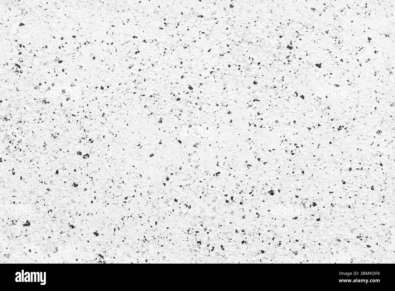 Hochauflösendes, nahtloses Foto einer weißen strukturierten Oberfläche mit schwarzen Sprenkeln, geeignet als Hintergrund, Muster oder Designelement in Kreationen Stockfoto