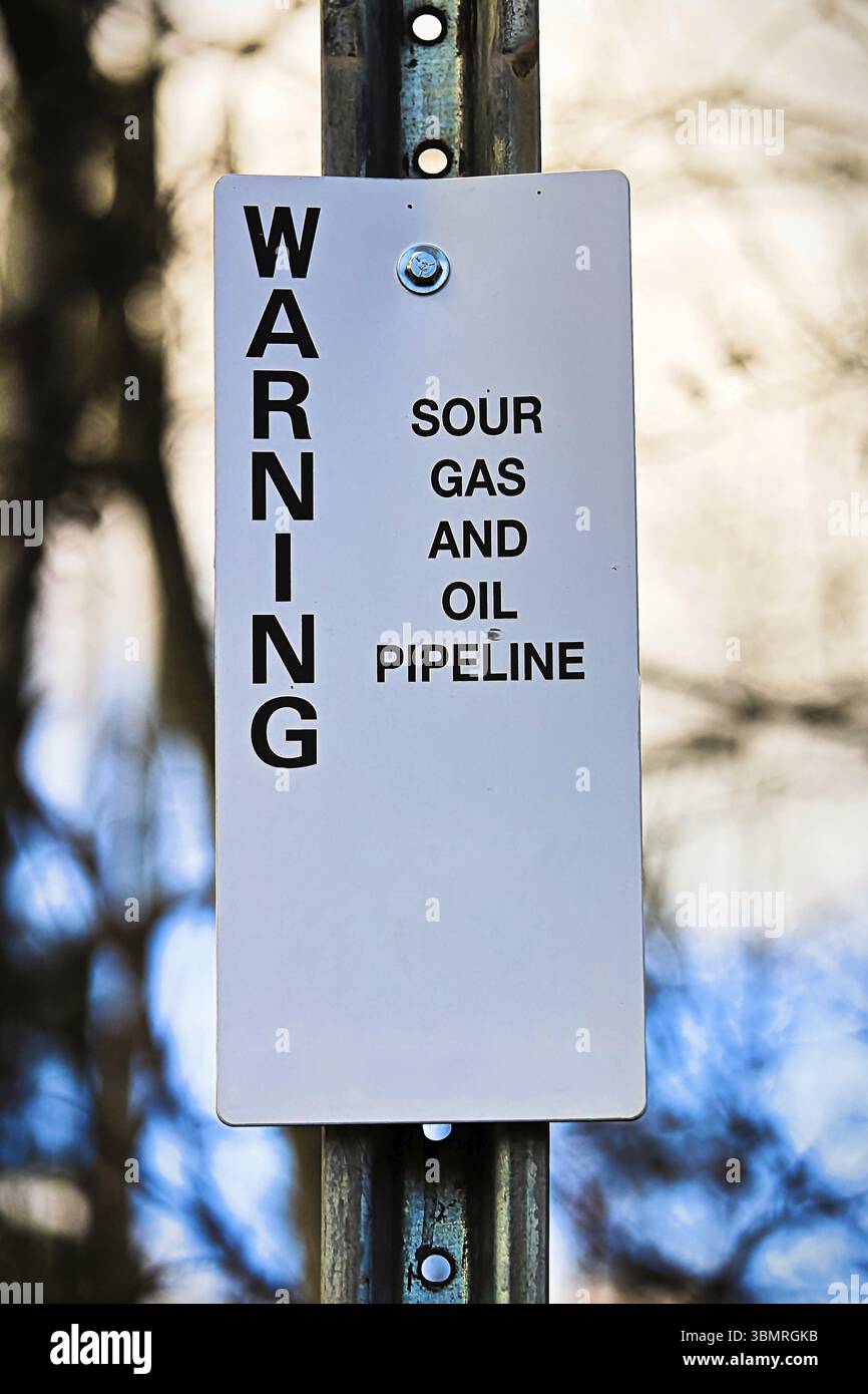 Warnschild für saure Gas- und Ölpipeline Stockfoto