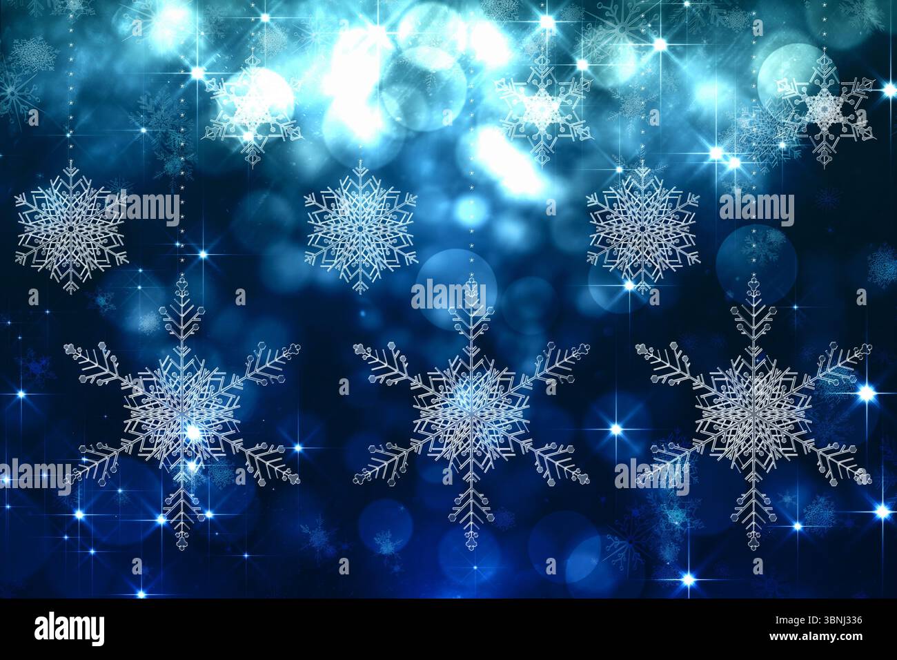 Schneeflocken vor blauen Weihnachtslichtern Stockfoto