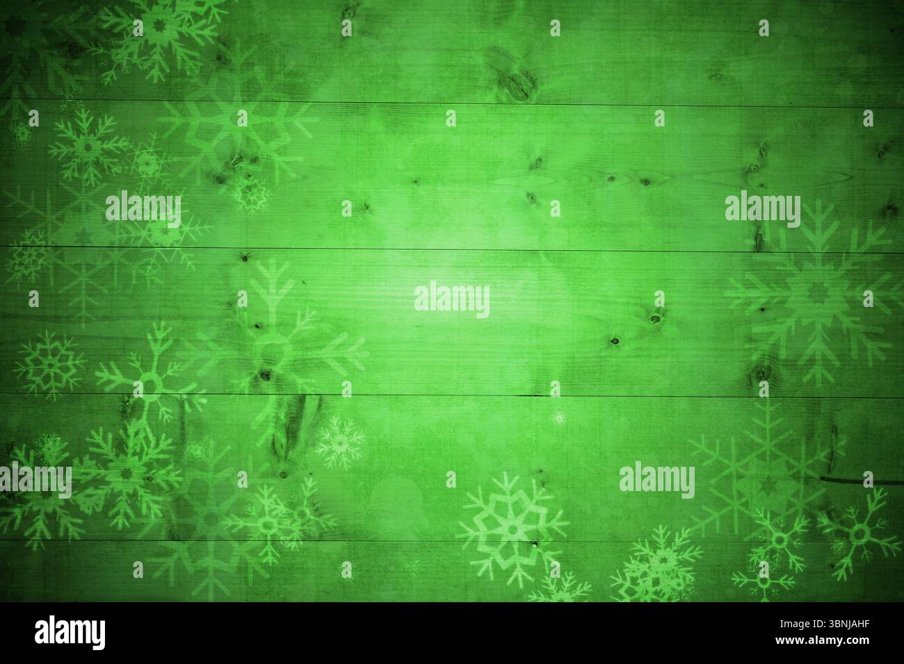 Schneeflockenmuster auf grünen Planken Stockfoto