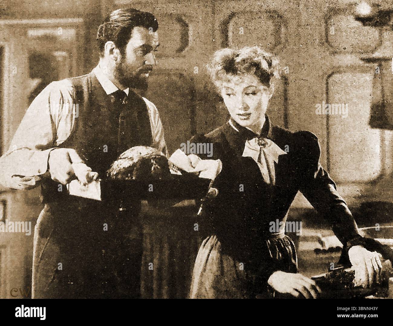 FILM - FILME - KINO - GESCHICHTE - Walter Pidgeon ( Walter Davis Pidgeon 1897-1984) und Greer Garson (1904-1996) in MGM's Film Marie Curie (1944). Stockfoto