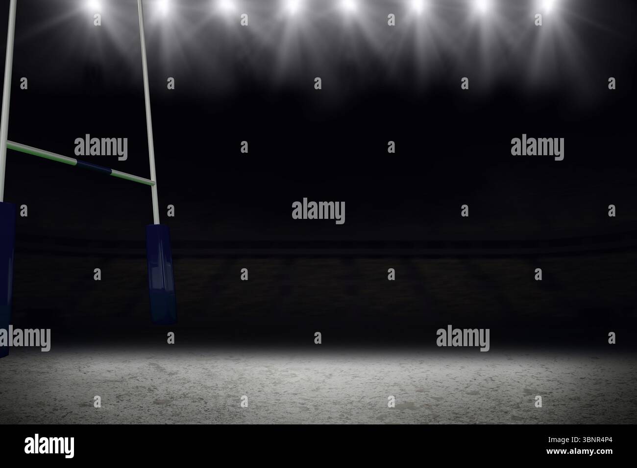 Der hohe Torpfosten steht nachts auf dem leeren Stadionfeld, die Flutlichter leuchten hell Stockfoto