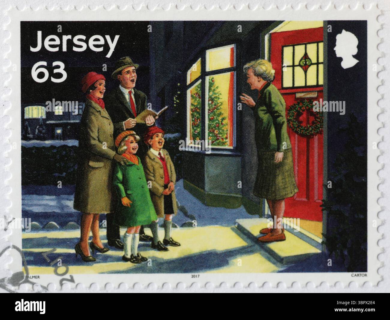 Die Familie singt ein weihnachtslied auf der Marke von Jersey Stockfoto