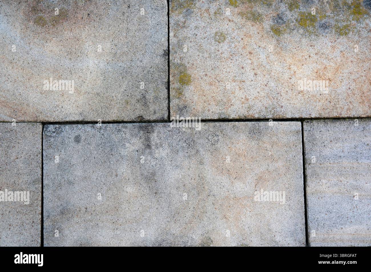 Nahaufnahme eines alten Betonbodens mit Mustern und Texturen. Stockfoto