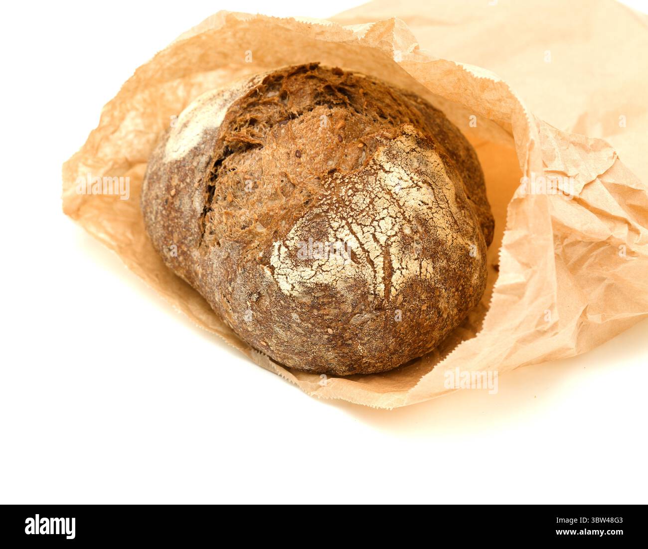Sauerteig gesäuertes rundes Malzbrot mit verschiedenen Samen Stockfoto