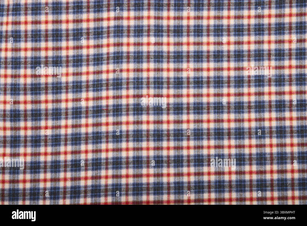 Kariertes Flanellmaterial. Hintergrund der Tartanstruktur. hemdmaterial mit Karomuster. Werkstoff Stockfoto