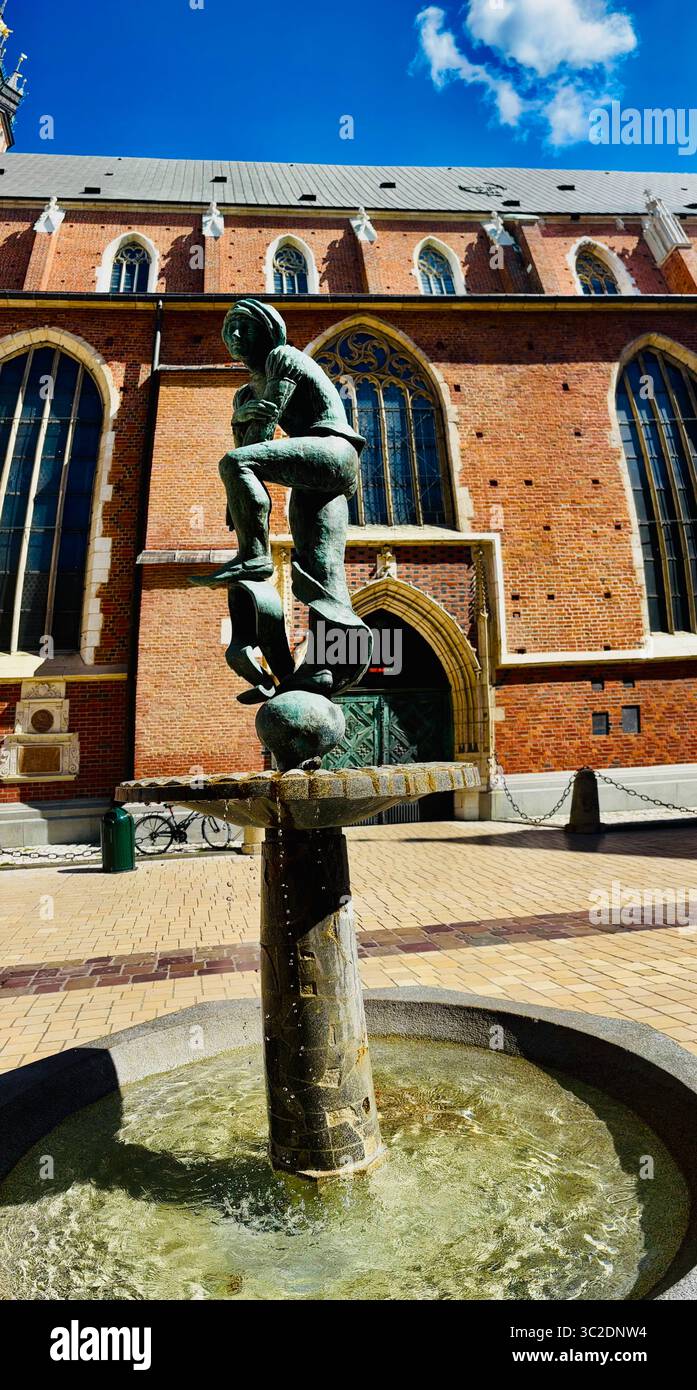 ŻAK Brunnen auf der Plac Mariacki, Kraków, Polen - Smartphone-aufgenommenes Stockfoto