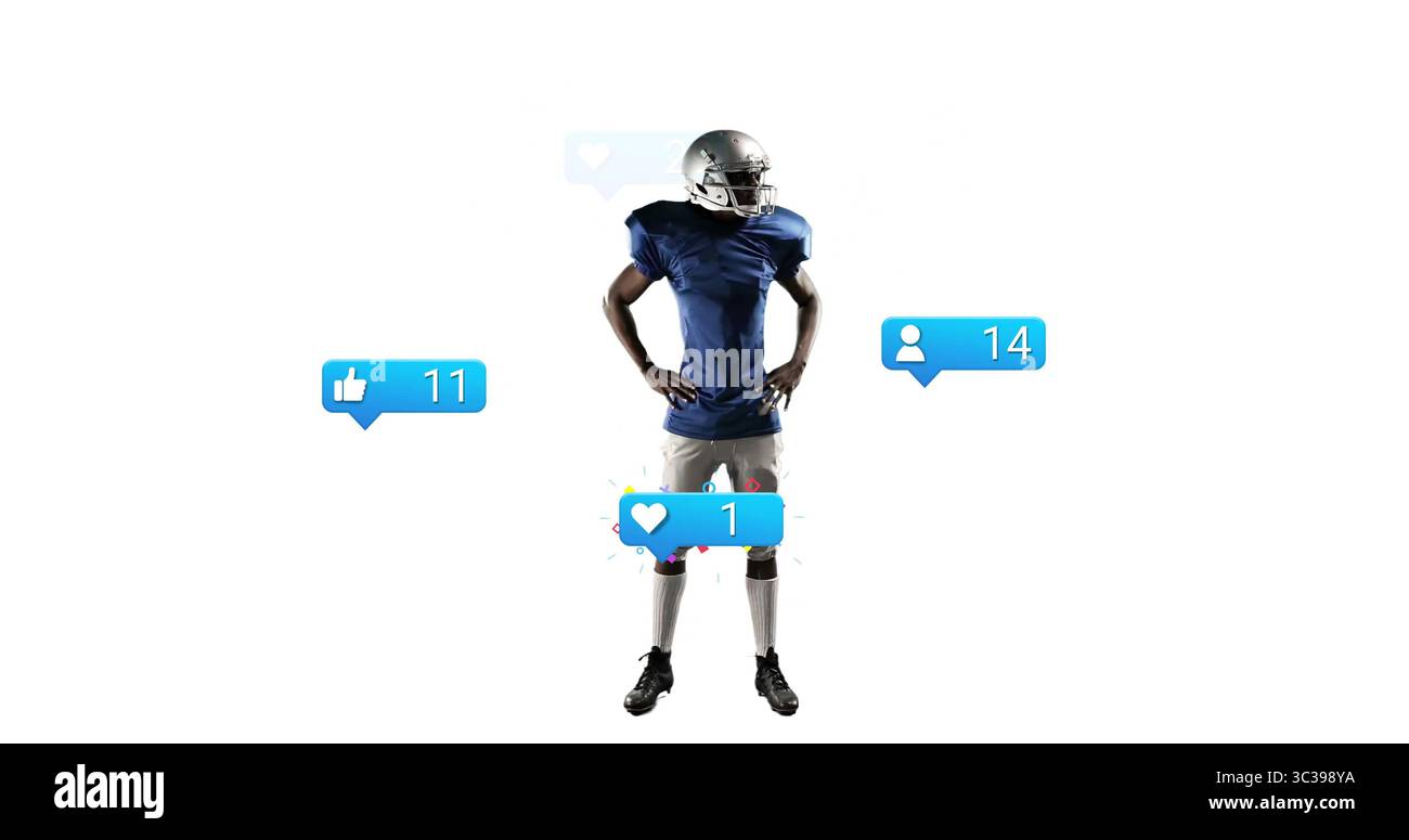 Posierender Fußballspieler mit silbernem Helm und blauem Trikot im Studio, mit Benachrichtigungssymbolen Stockfoto