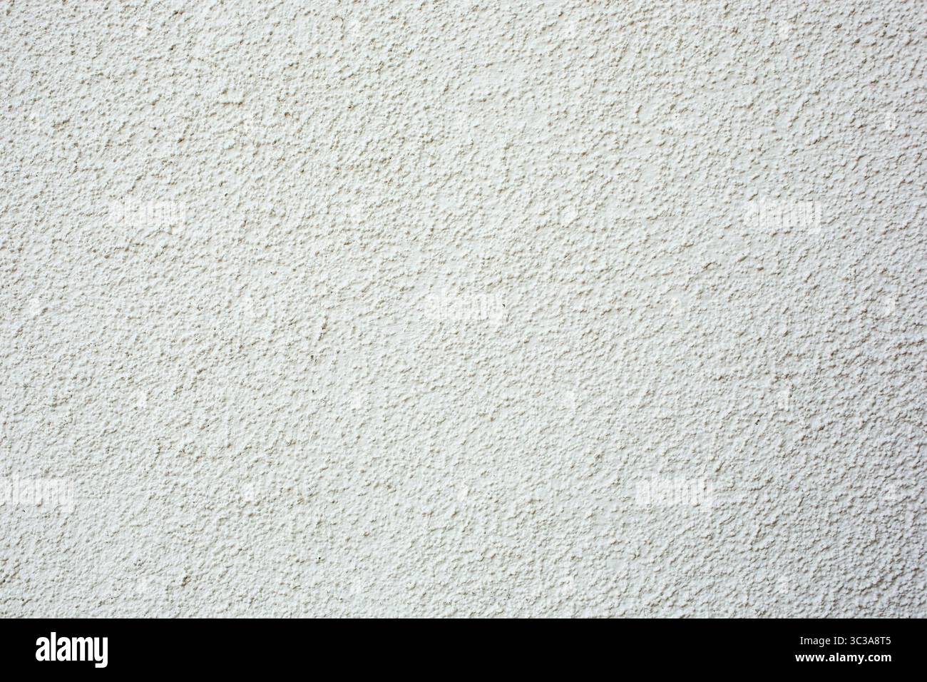 Eine Ansicht einer Stuckwand im Stil eines Kieselsteins als Hintergrund. Stockfoto