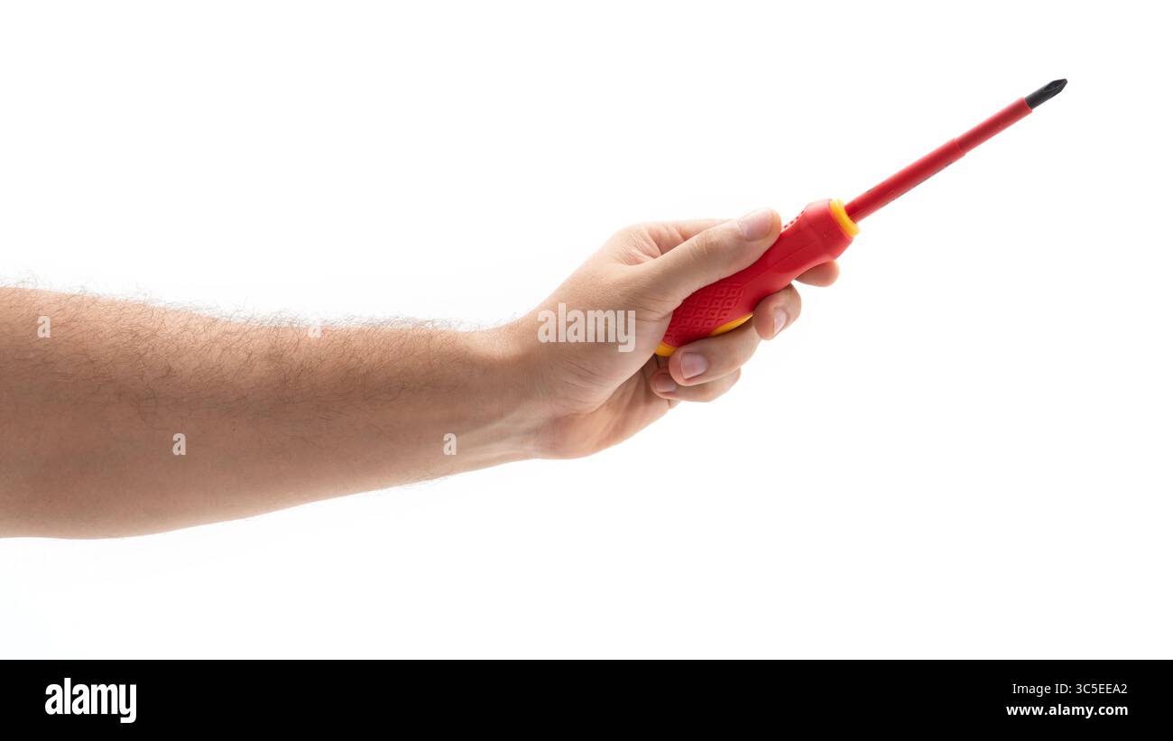 Halten Sie einen Schraubendreher mit einem roten Griff von Hand Stockfoto