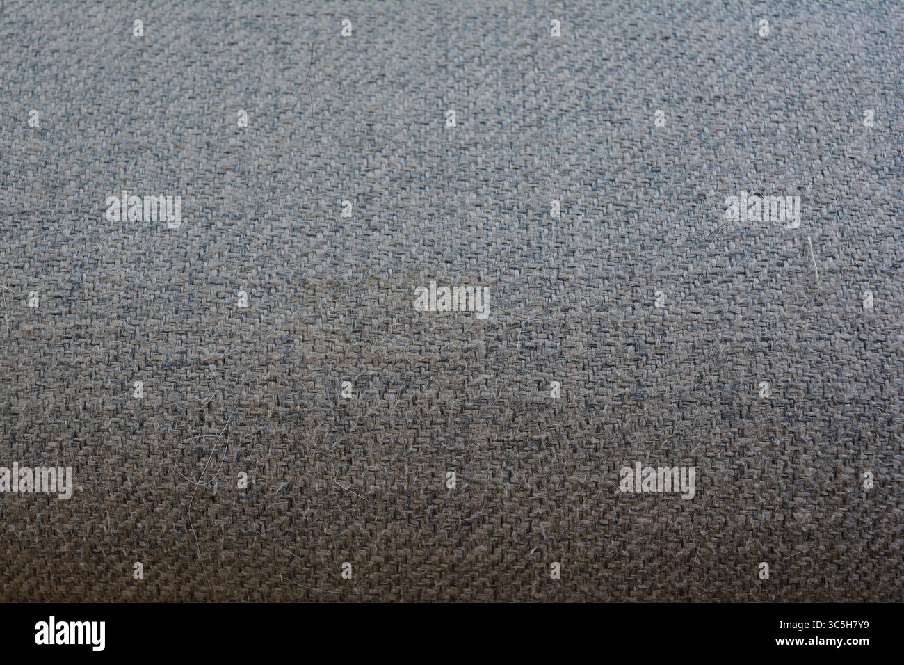Nahaufnahme der neutralen Textur aus gewebtem Gewebe – nahtloser Hintergrund Stockfoto