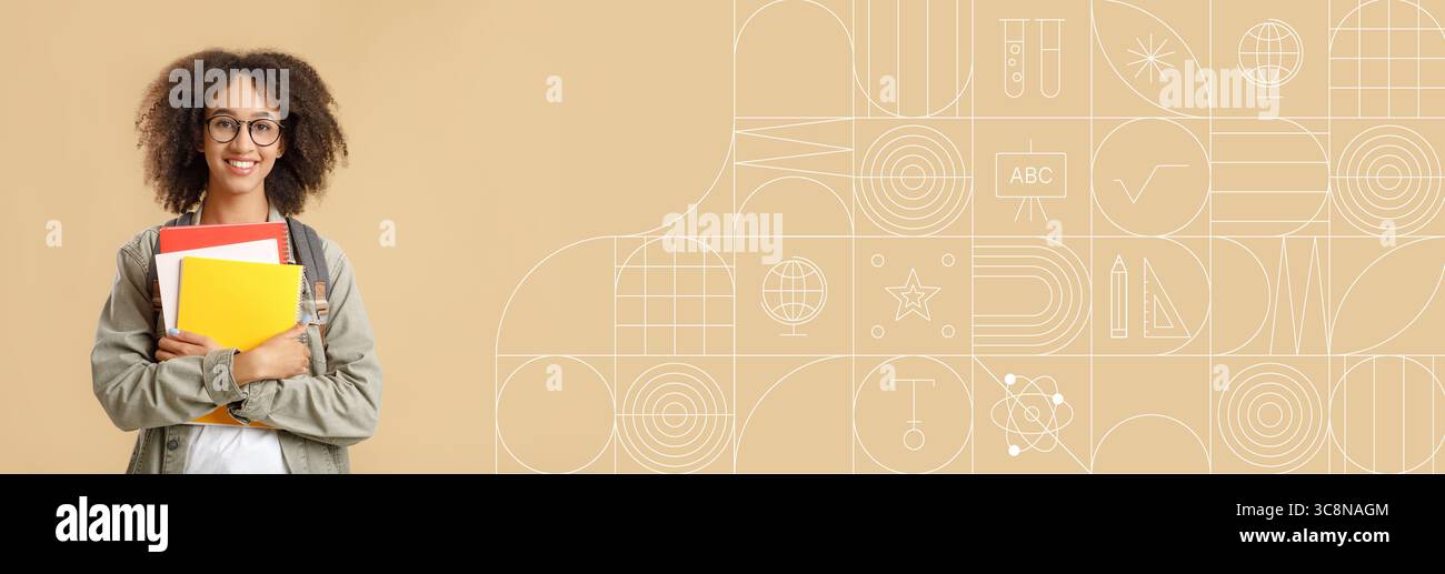 Student, der mit Büchern in einer kreativen pädagogischen Umgebung studiert Stockfoto