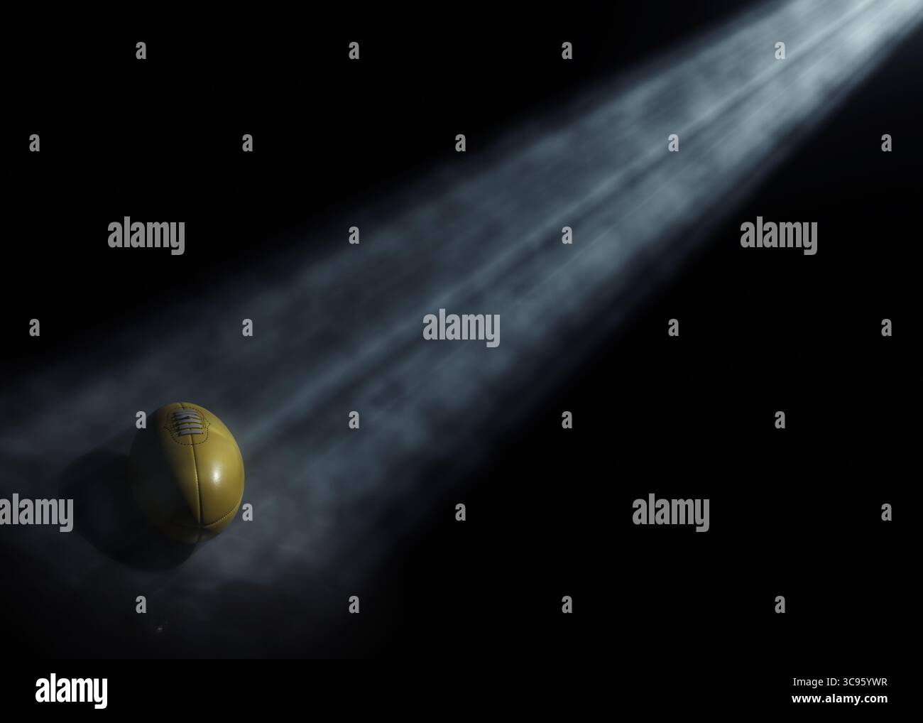 Ein australischer Sportball wird von einem einzigen ätherischen Lichtstrahl auf einem dunkelschwarzen Hintergrund beleuchtet – 3D-Rendering Stockfoto
