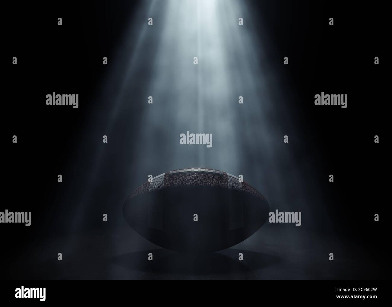 Ein american Football-Sportball, der von einem einzigen ätherischen Licht auf einem dunkelschwarzen Hintergrund beleuchtet wird – 3D-Rendering Stockfoto